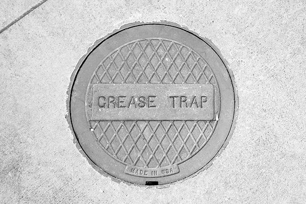 regular grease trap pumping helps prevent clogs, foul odors, and potential environmental contamination