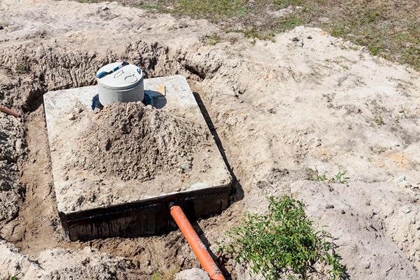 signs that your septic tank needs pumping include slow drains, sewer odors, and pooling water in the yard